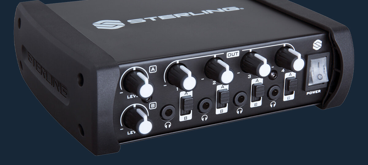 Sterling SHA4 4-channel desktop headphone amplifier right on blue background.