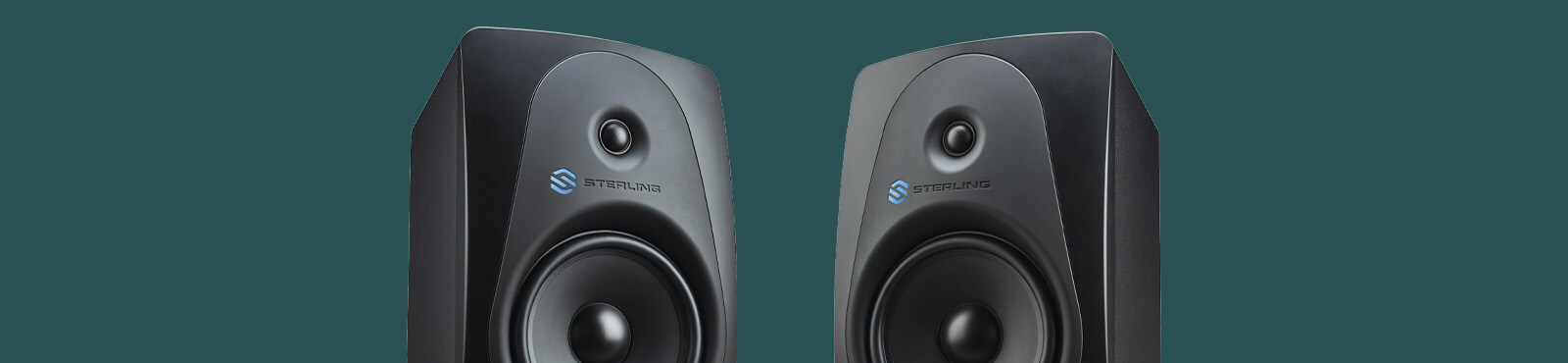 Sterling MX8 8-inch powered studio monitor right and left on wide green background.